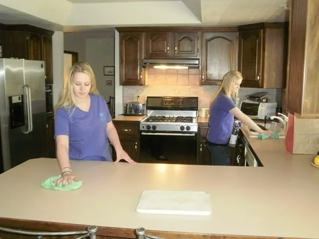 GreenClean Colorado cleaners wiping down kitchen counters